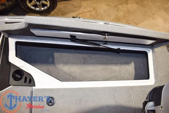Slide: The Image of Open storage compartment in a 2025 Nitro Z18 Pro boat interior. - 27