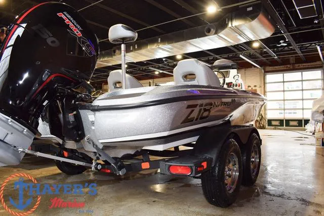 Slide: The Image of 2025 Nitro Z18 Pro boat on trailer in showroom, featuring powerful engine and sleek design. - 3