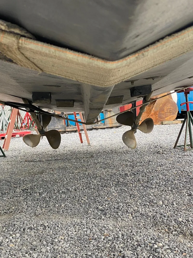 Slide: The Image of Underside view of a 1990 Viking 45 Convertible boat with dual propellers. - 4