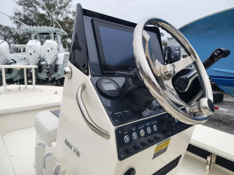 Slide: The Image of 2024 Sterling 180TS boat console with steering wheel and navigation display. - 10
