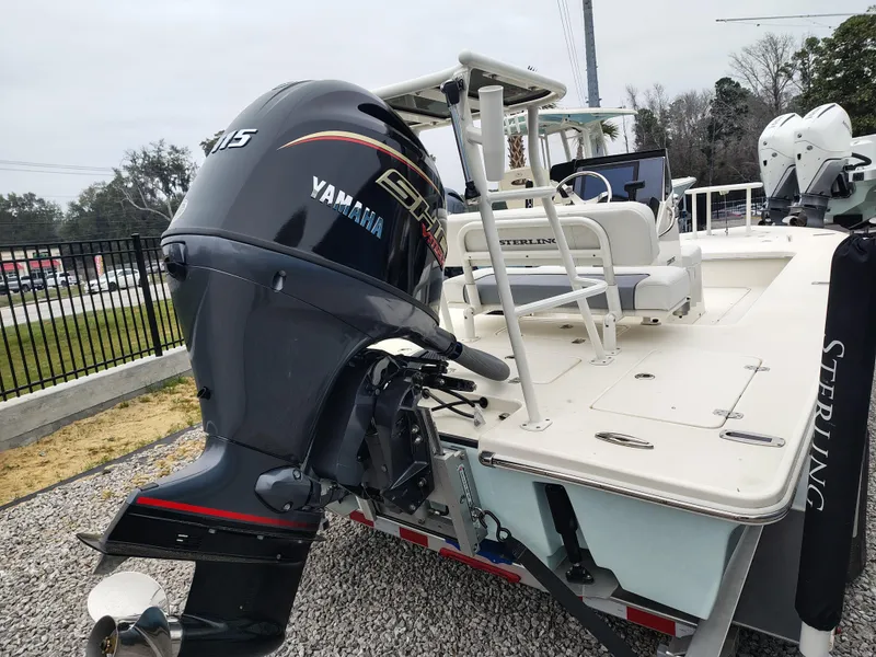 Slide: The Image of 2024 Sterling 180TS boat with Yamaha outboard motor, displayed on gravel lot. - 11