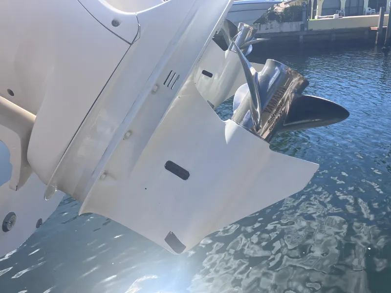 Slide: The Image of Close-up of a 2018 Grady-White Canyon 336 boat engine in water. - 10