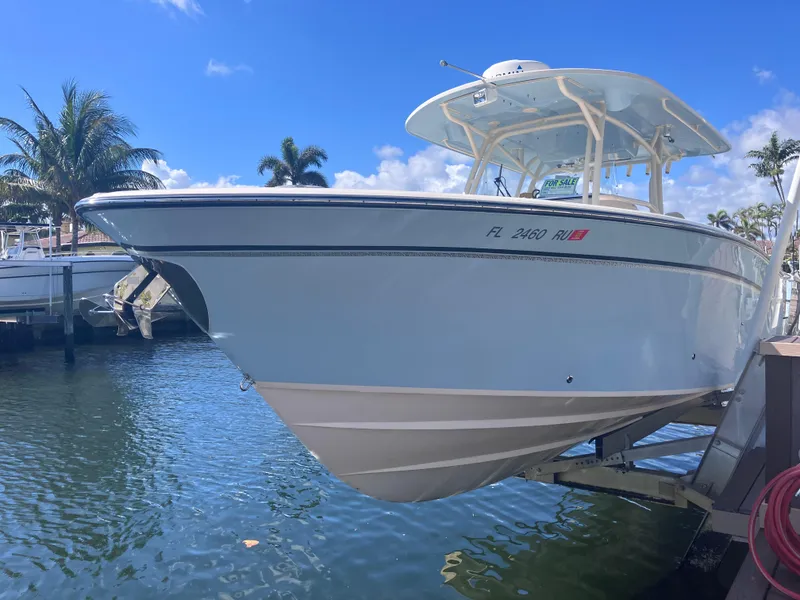 Slide: The Image of 2018 Grady-White Canyon 336 boat docked on a sunny day. - 14