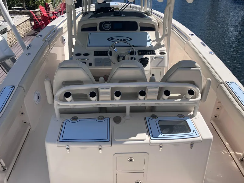 Slide: The Image of 2018 Grady-White Canyon 336 boat interior with helm and seating area. - 18