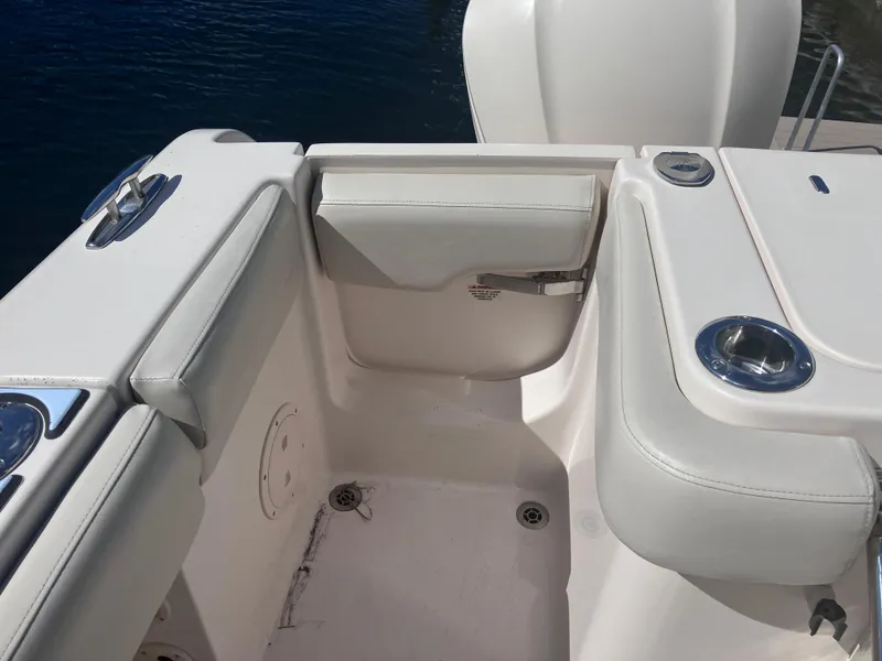 Slide: The Image of 2018 Grady-White Canyon 336 boat interior with white seating and cup holders. - 23