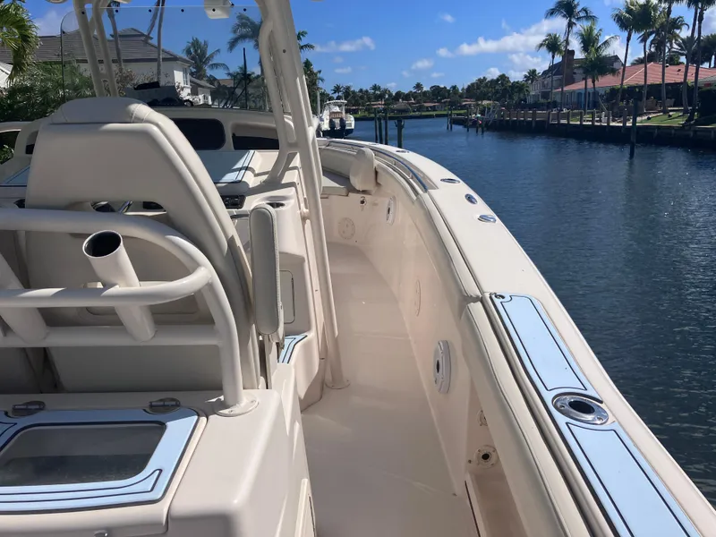 Slide: The Image of 2018 Grady-White Canyon 336 boat docked on a sunny canal. - 24