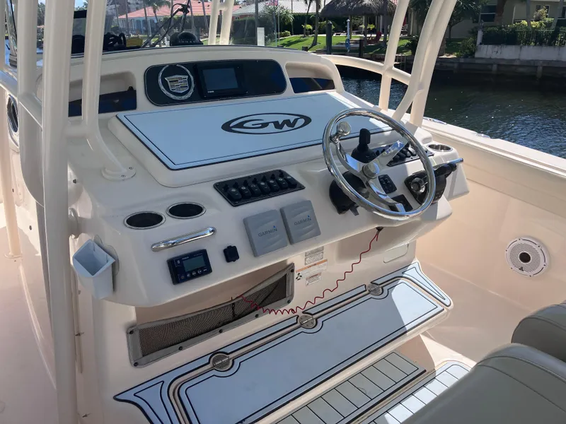 Slide: The Image of 2018 Grady-White Canyon 336 boat helm with steering wheel and control panel. - 28