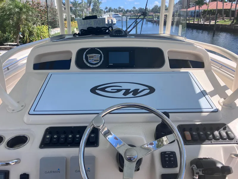Slide: The Image of 2018 Grady-White Canyon 336 helm with steering wheel and control panel. - 29