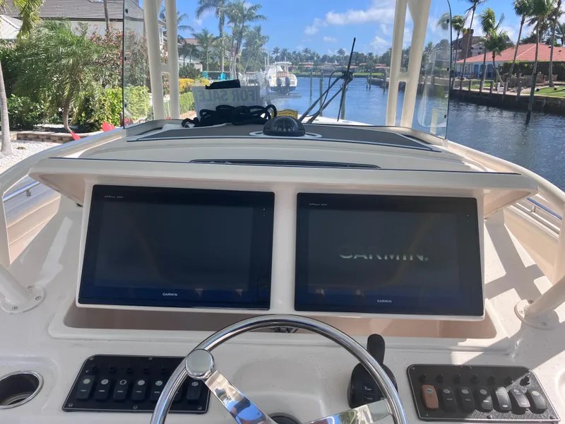 Slide: The Image of 2018 Grady-White Canyon 336 boat dashboard with dual Garmin displays. - 30
