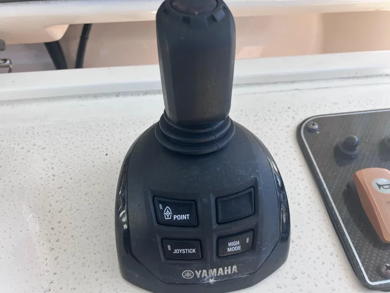 Slide: The Image of Yamaha joystick control on 2018 Grady-White Canyon 336 boat dashboard. - 33
