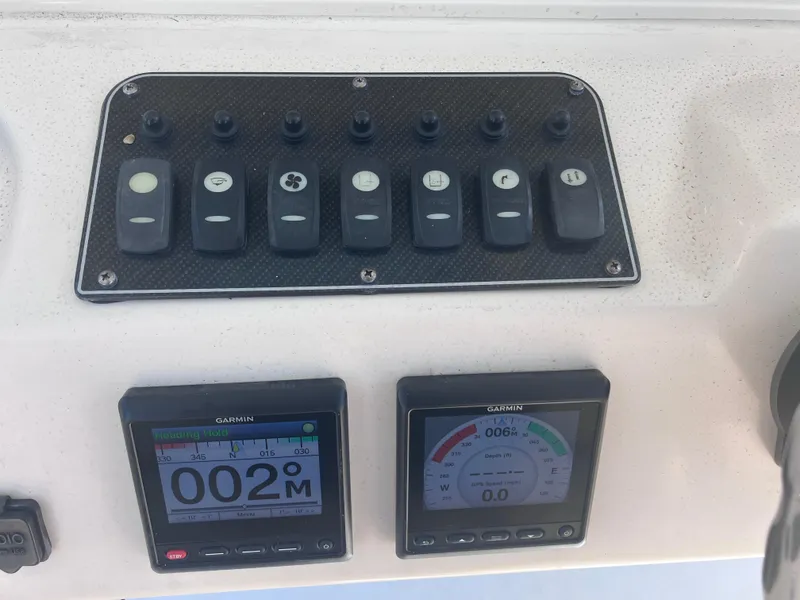 Slide: The Image of Control panel of 2018 Grady-White Canyon 336 boat with Garmin displays. - 36