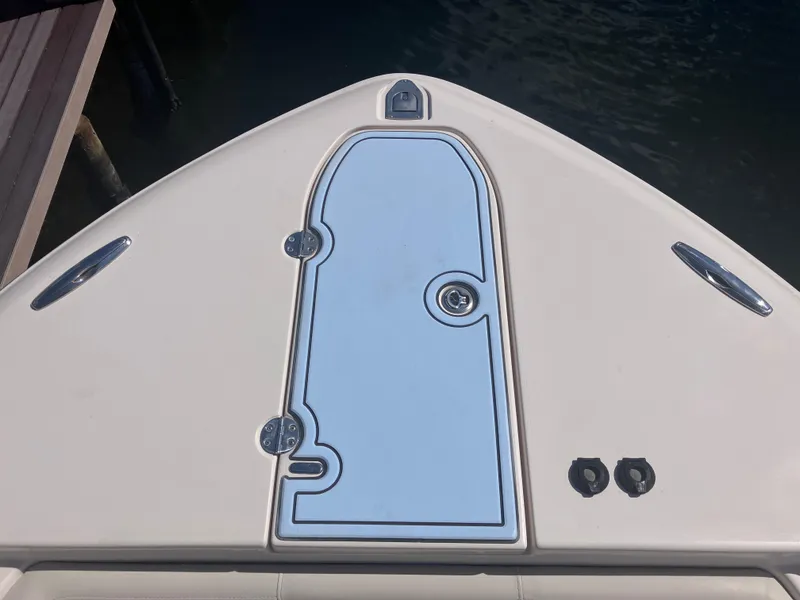 Slide: The Image of 2018 Grady-White Canyon 336 boat deck, featuring sleek design and storage hatch. - 44