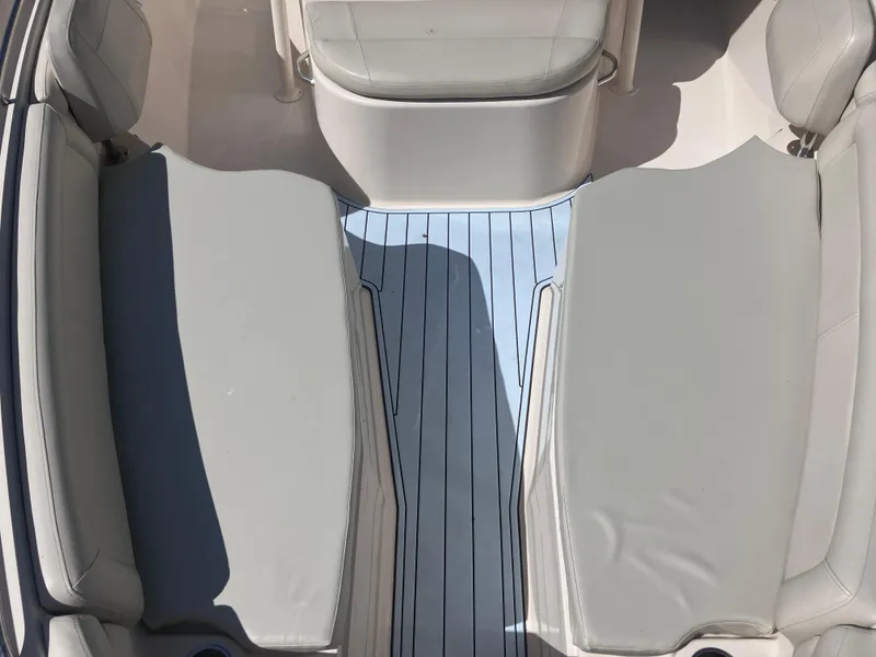 Slide: The Image of Interior seating of 2018 Grady-White Canyon 336 boat, featuring light gray cushions. - 48