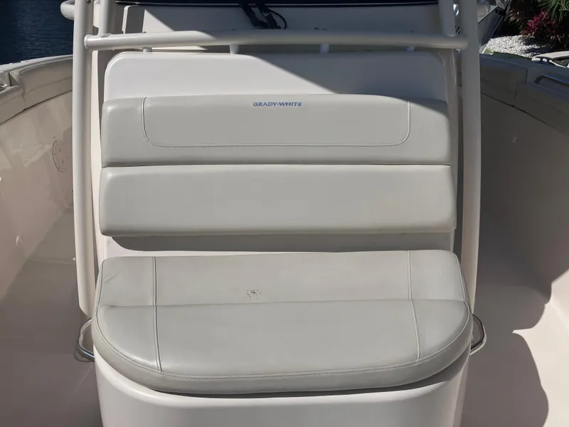 Slide: The Image of 2018 Grady-White Canyon 336 boat seating, featuring white cushioned seats. - 49