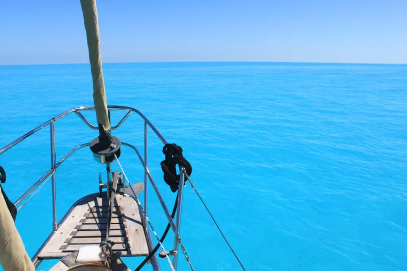 Slide: The Image of Bow of 1983 Whitby 42 Ketch sailing on clear blue ocean. - 4