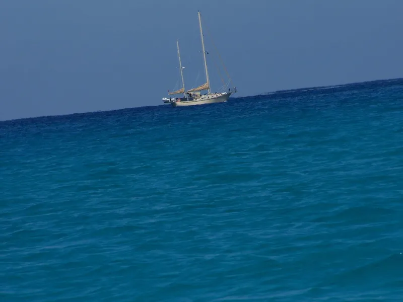 Slide: The Image of Sailing yacht Whitby 42 Ketch from 1983 on open blue sea. - 7