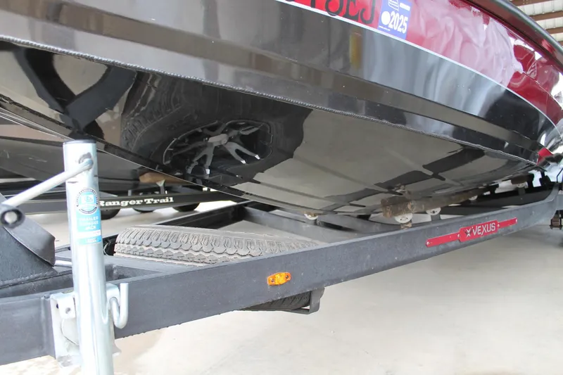 Slide: The Image of 2023 Vexus AVX2080 boat on trailer, close-up view of hull and tire. - 15