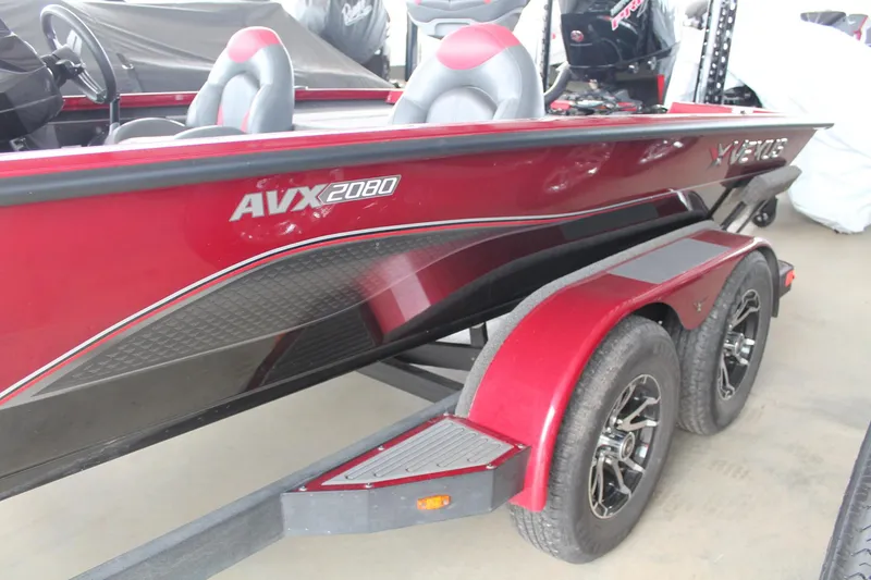 Slide: The Image of 2023 Vexus AVX2080 boat, red and black design, on a trailer. - 16