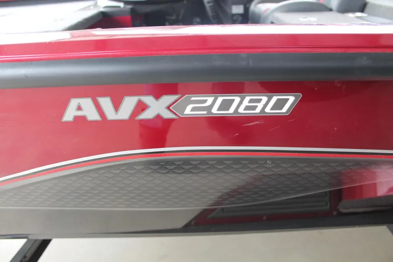 Slide: The Image of 2023 Vexus AVX2080 boat, red exterior with model branding. - 17