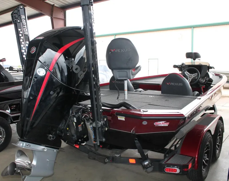 Slide: The Image of 2023 Vexus AVX2080 boat with powerful engine and sleek design in a showroom. - 18