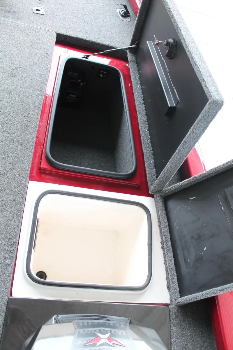 Slide: The Image of 2023 Vexus AVX2080 boat storage compartments with open lids, showcasing interior space. - 23