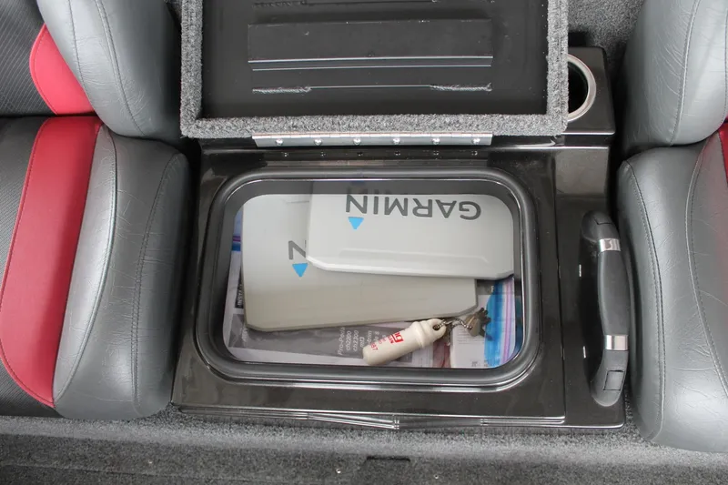 Slide: The Image of 2023 Vexus AVX2080 storage compartment with Garmin equipment and accessories. - 25