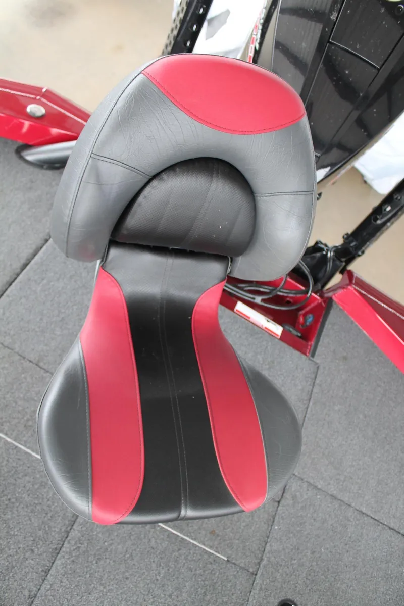 Slide: The Image of 2023 Vexus AVX2080 boat seat, black and red design, on a carpeted deck. - 27