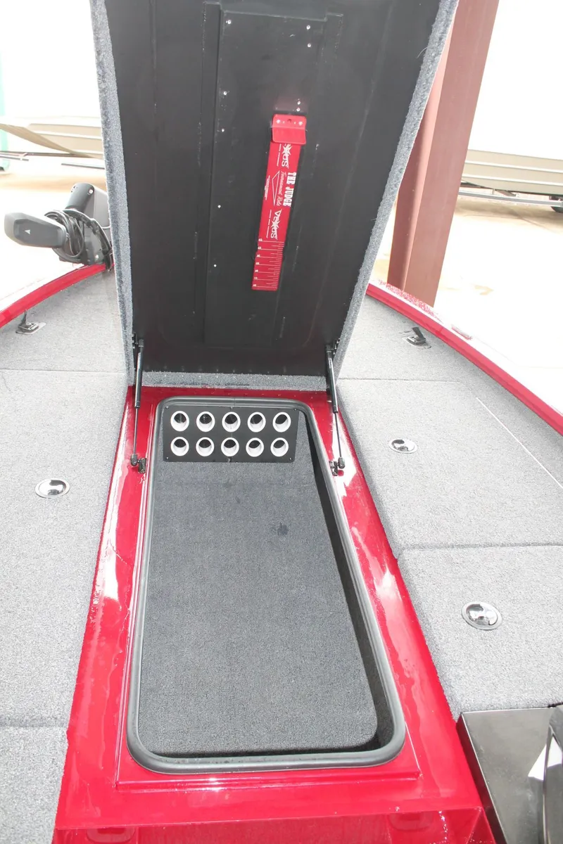 Slide: The Image of 2023 Vexus AVX2080 boat storage compartment with open lid and organized interior. - 7
