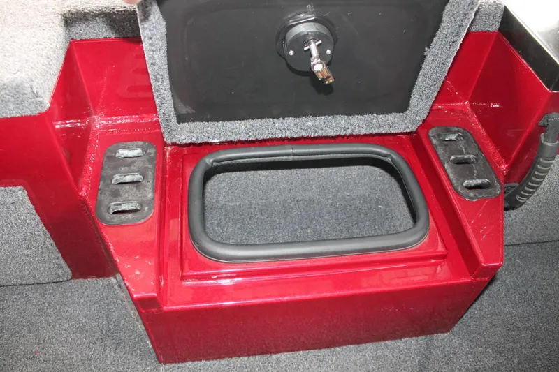 Slide: The Image of 2023 Vexus AVX2080 boat storage compartment with red finish and carpeted interior. - 9