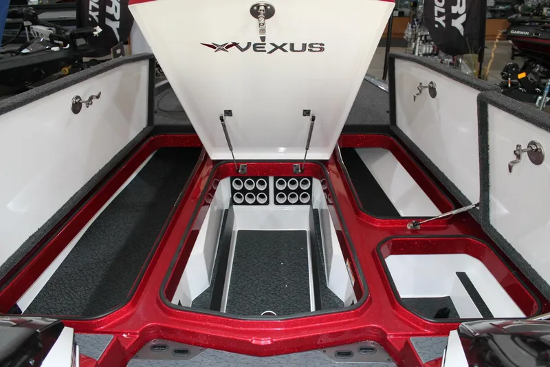 Slide: The Image of 2025 Vexus VXS21 boat interior with open storage compartments and rod holders. - 13