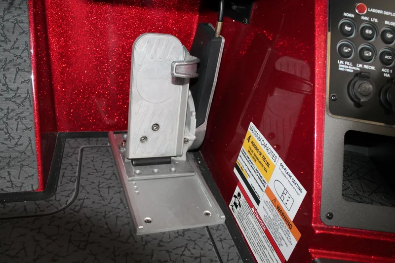 Slide: The Image of 2025 Vexus VXS21 boat pedal and control panel with warning labels. - 17