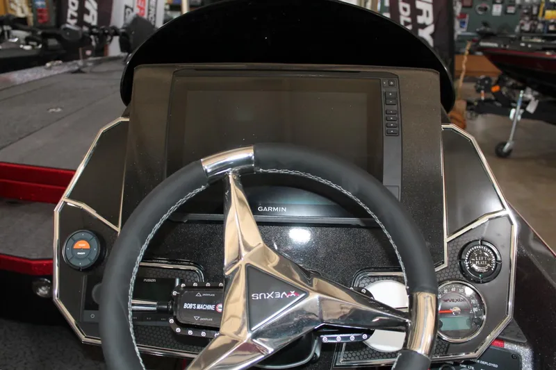 Slide: The Image of 2025 Vexus VXS21 boat dashboard with Garmin display and steering wheel. - 18