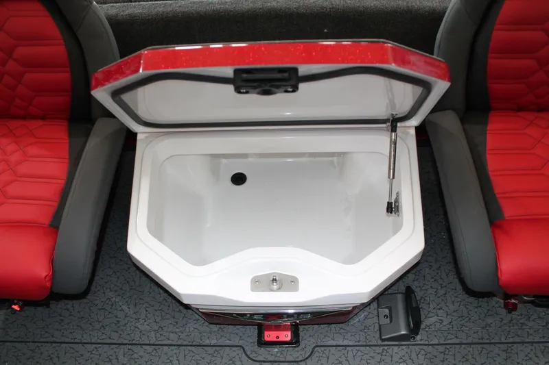 Slide: The Image of Open storage compartment in 2025 Vexus VXS21 boat, surrounded by red and gray seating. - 20