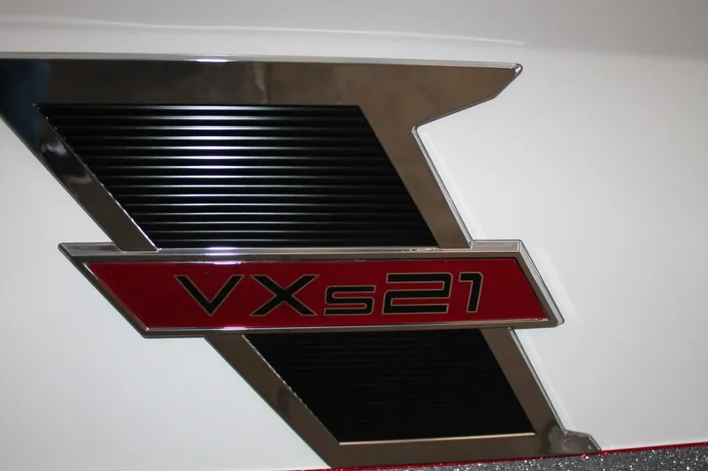 Slide: The Image of 2025 Vexus VXS21 logo on a sleek, modern design background. - 23