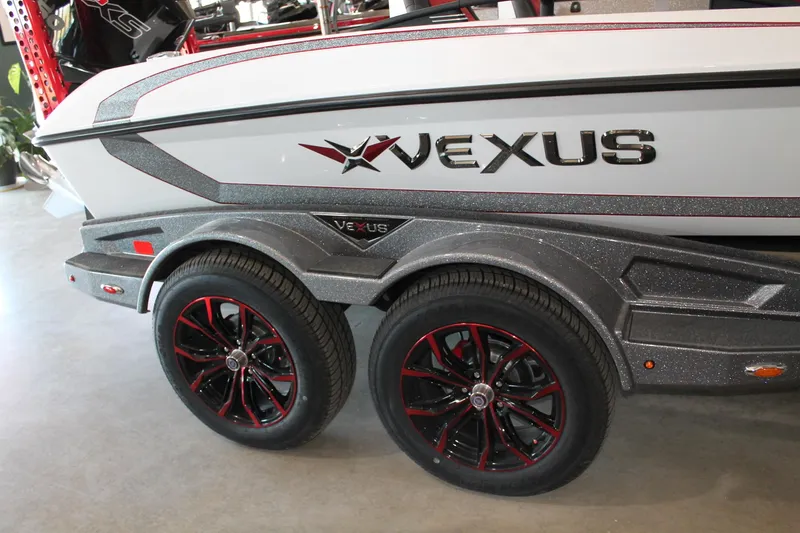 Slide: The Image of 2025 Vexus VXS21 boat trailer with stylish black and red wheels. - 28