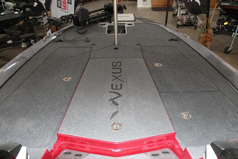 Slide: The Image of 2025 Vexus VXS21 boat deck with storage compartments and logo. - 29