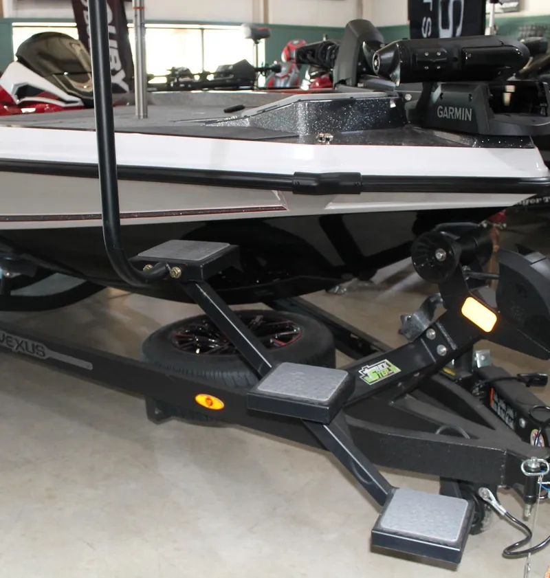 Slide: The Image of 2025 Vexus VXS21 boat on trailer with Garmin equipment, featuring sturdy steps. - 3