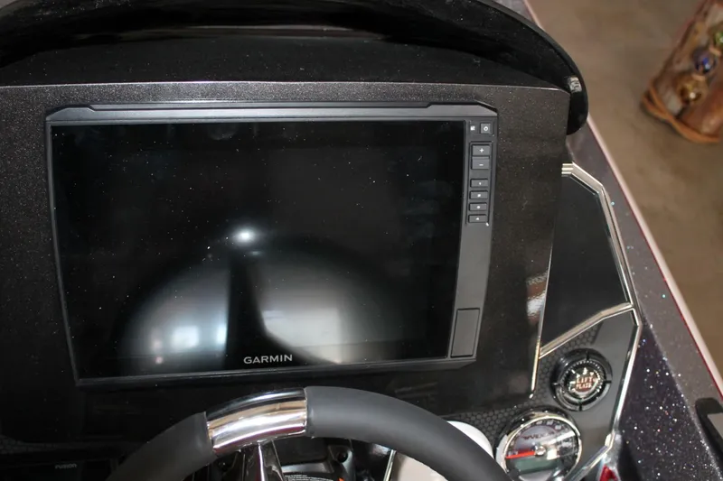 Slide: The Image of 2025 Vexus VXS21 dashboard with Garmin display and steering wheel. - 33