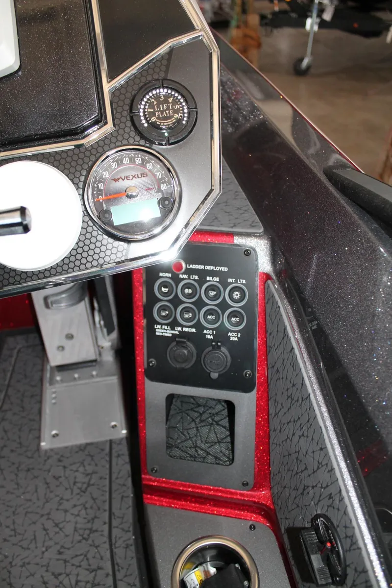 Slide: The Image of Control panel of a 2025 Vexus VXS21 boat with gauges and switches. - 34