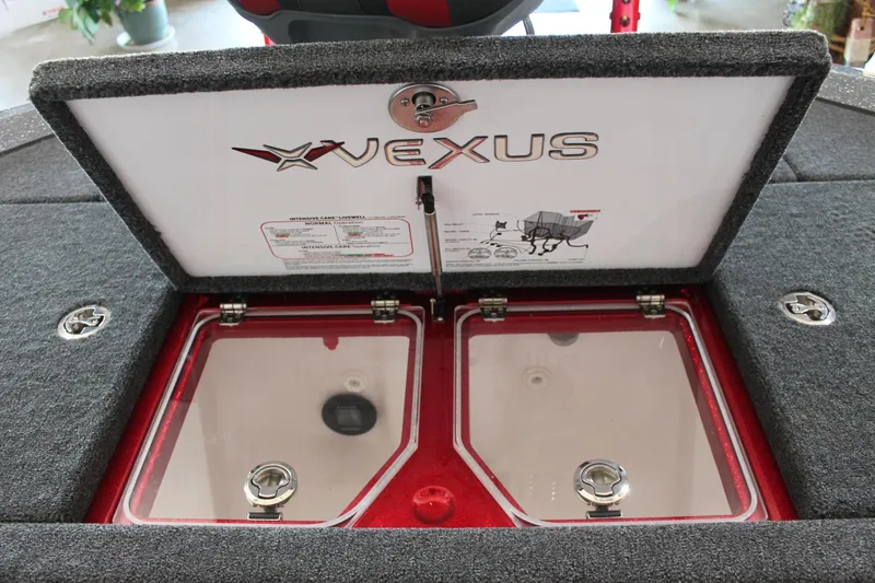 Slide: The Image of 2025 Vexus VXS21 boat storage compartment with dual transparent lids and logo. - 37