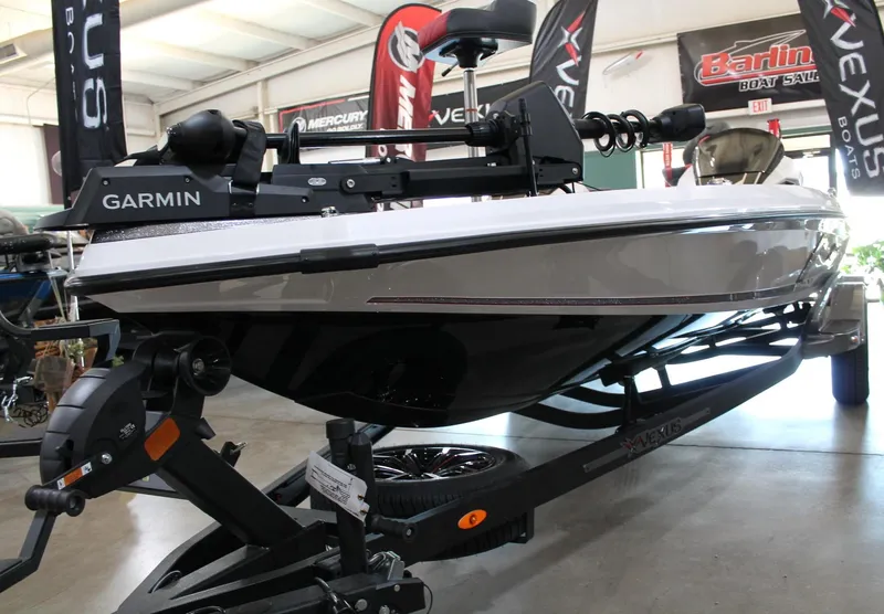 Slide: The Image of 2025 Vexus VXS21 boat with Garmin equipment on display in showroom. - 4