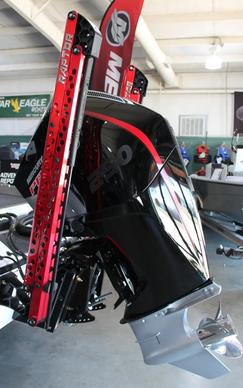 Slide: The Image of 2025 Vexus VXS21 boat with Mercury engine and Raptor power poles in showroom. - 6