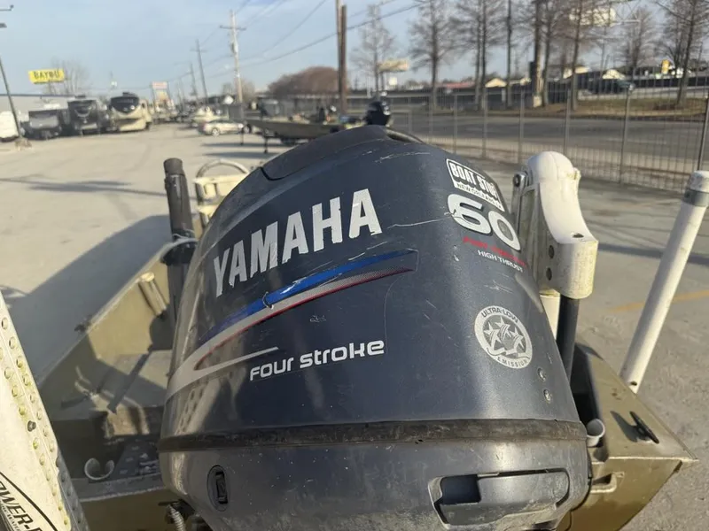 Slide: The Image of Yamaha 60 horsepower four-stroke outboard motor on a 2003 Gator Trax 20' boat. - 3