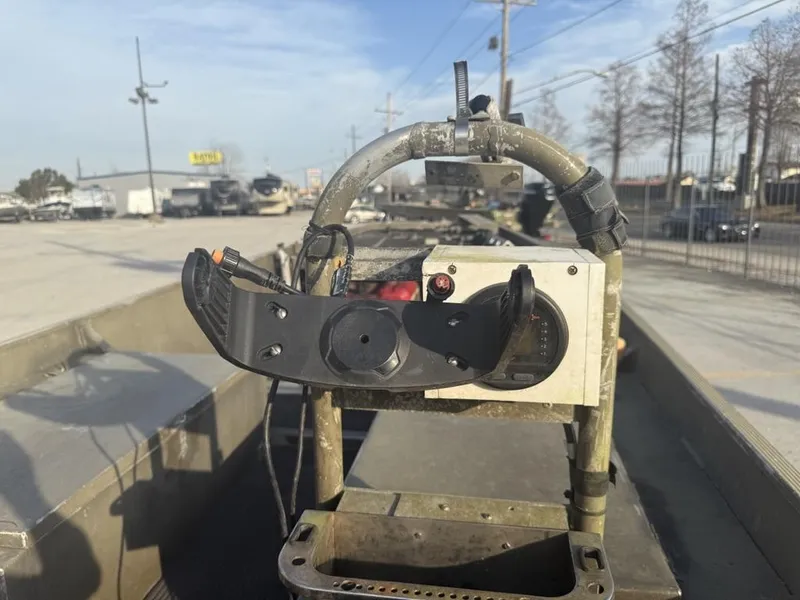 Slide: The Image of Control panel on a 2003 Gator Trax 20' boat, parked outdoors. - 4