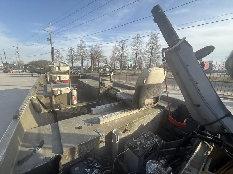 Slide: The Image of 2003 Gator Trax 20' boat interior with seats and equipment, parked outdoors. - 6