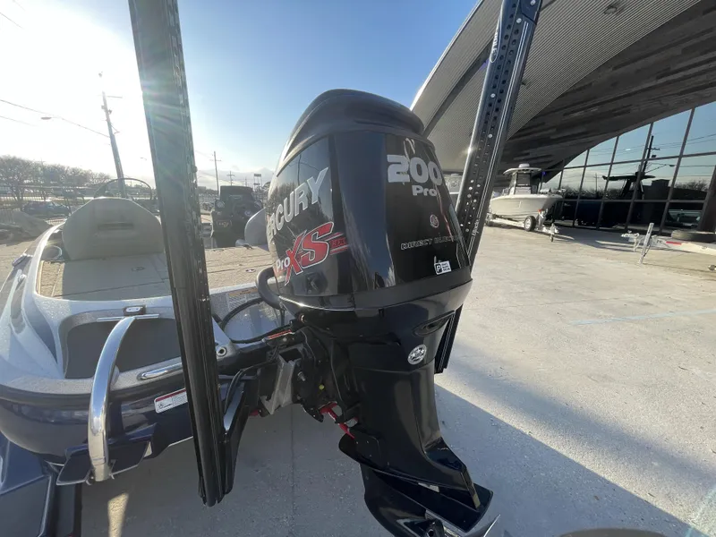 Slide: The Image of 2017 Nitro Z19 boat with Mercury 200 Pro XS engine, parked outdoors. - 13