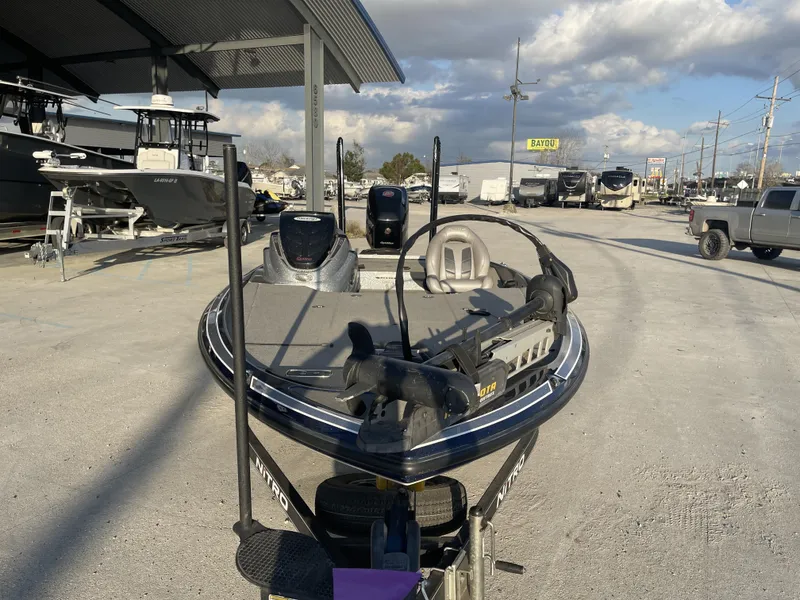 Slide: The Image of 2017 Nitro Z19 boat parked outdoors under a cloudy sky. - 14