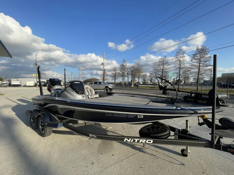 Slide: The Image of 2017 Nitro Z19 boat on trailer under blue sky. - 7