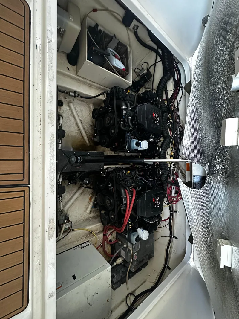 Slide: The Image of Engine compartment of 2003 Chaparral 330 Signature Cruiser with dual engines and wiring. - 10
