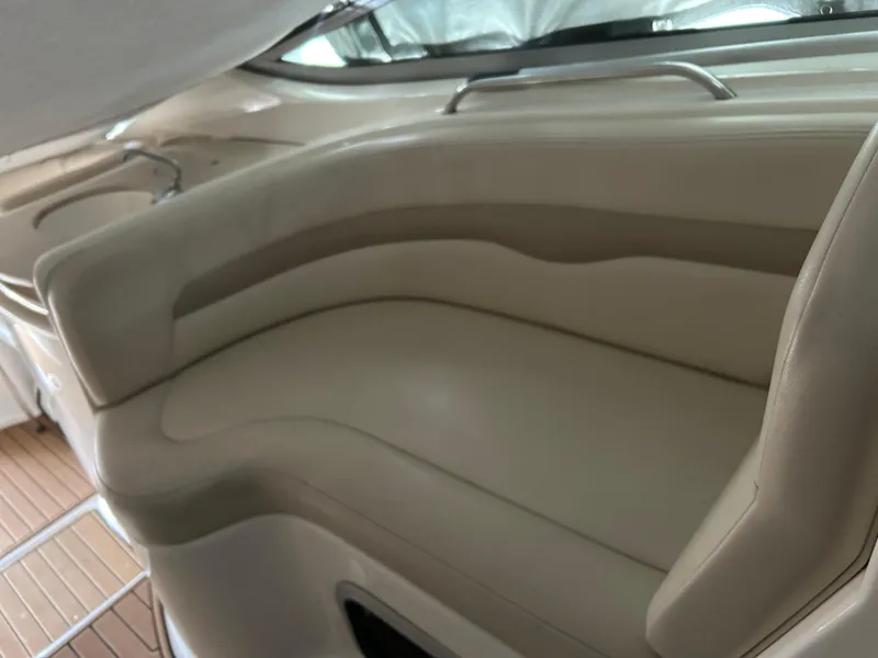 Slide: The Image of 2003 Chaparral 330 Signature Cruiser interior with beige seating and sleek design. - 16